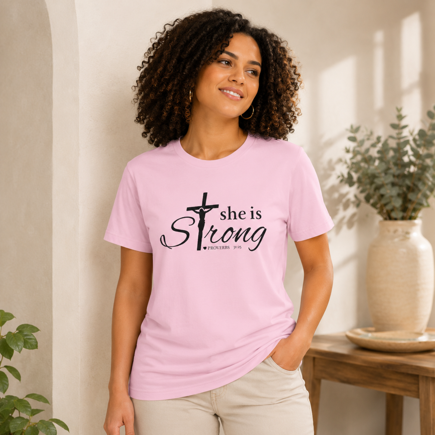 Pink Christian faith T-shirt with black cross and she is strong front graphic.