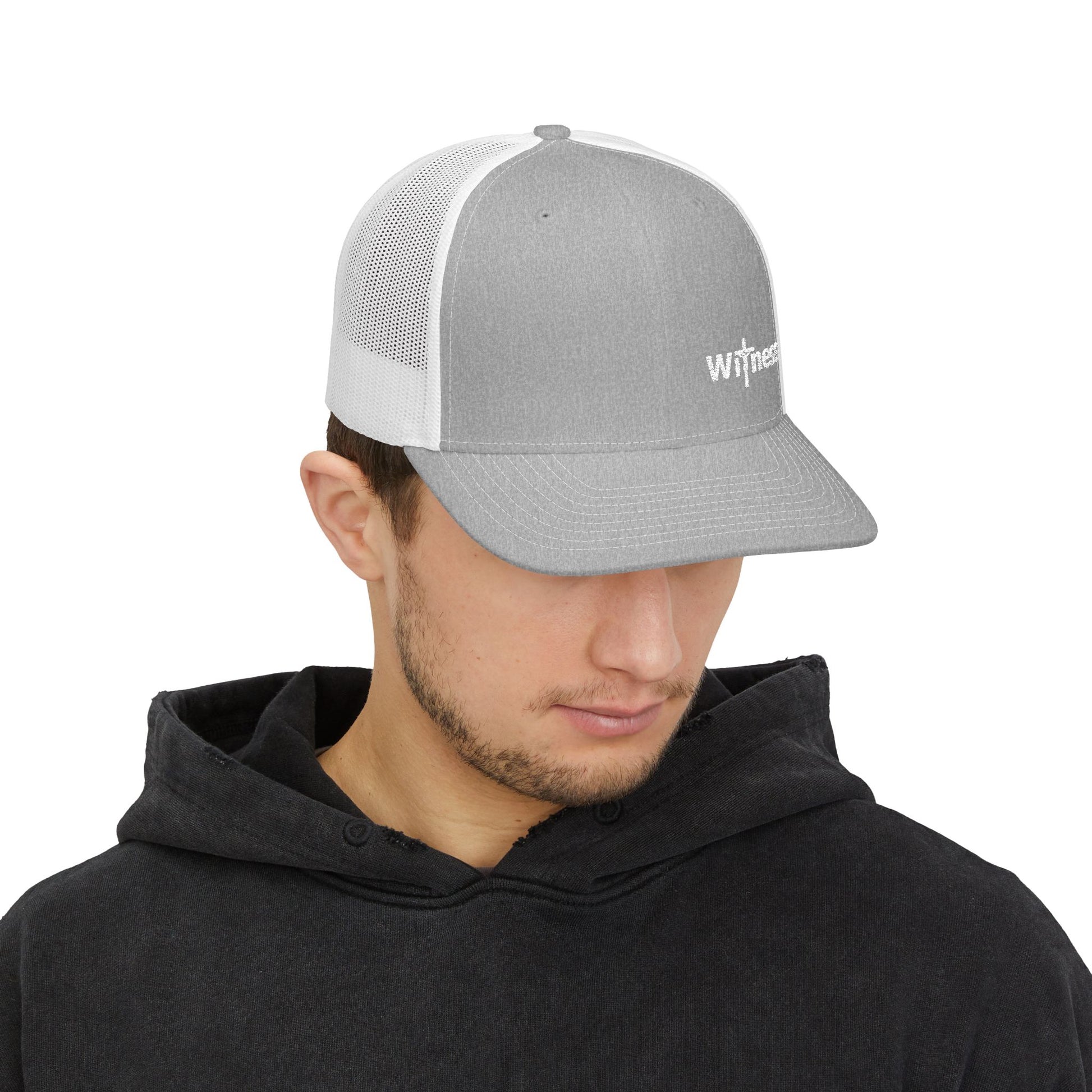Light grey trucker hat with white mesh back and small embroidered “Witness” logo