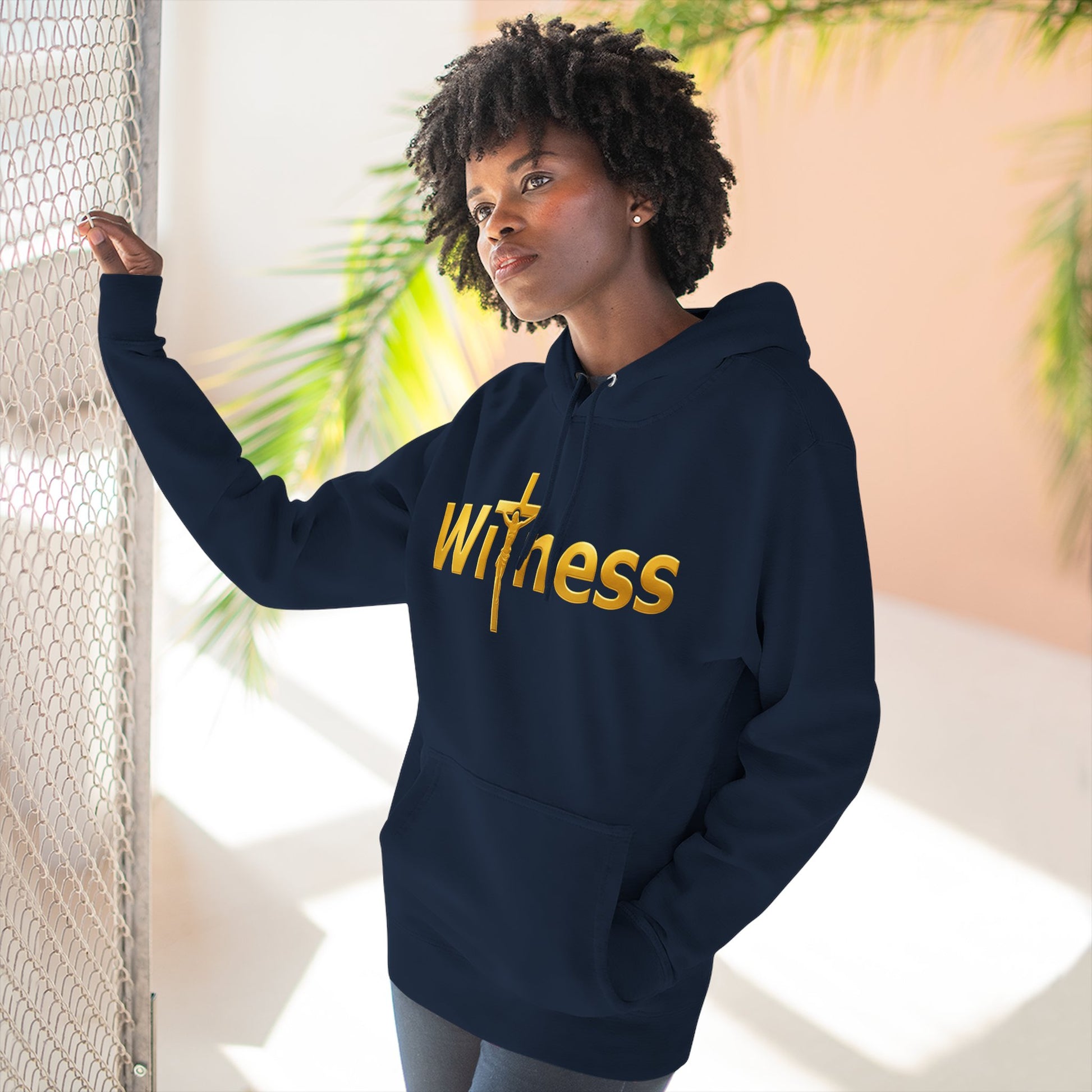 Navy pullover hoodie with gold “Witness” print and cross emblem, kangaroo pocket and hood.