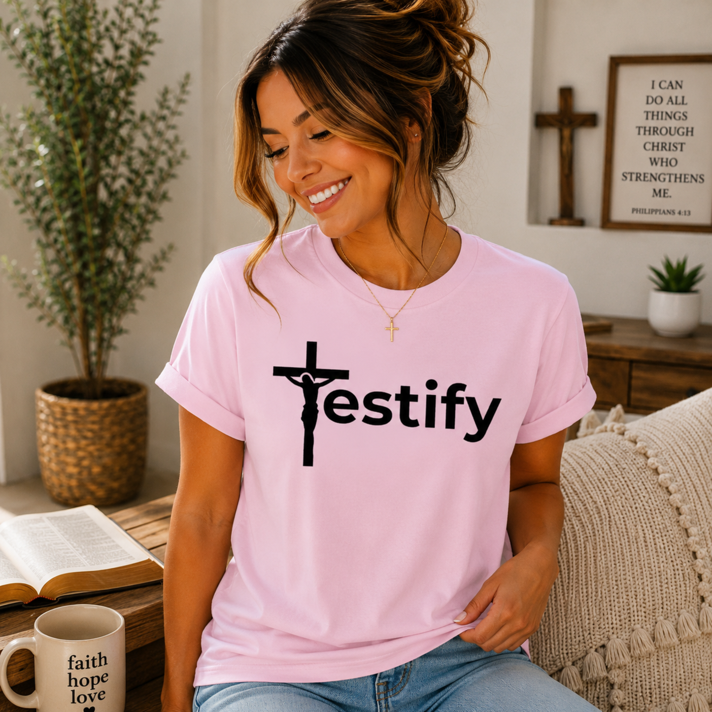 Pink Christian T-shirt with black cross and “Testify” front graphic.