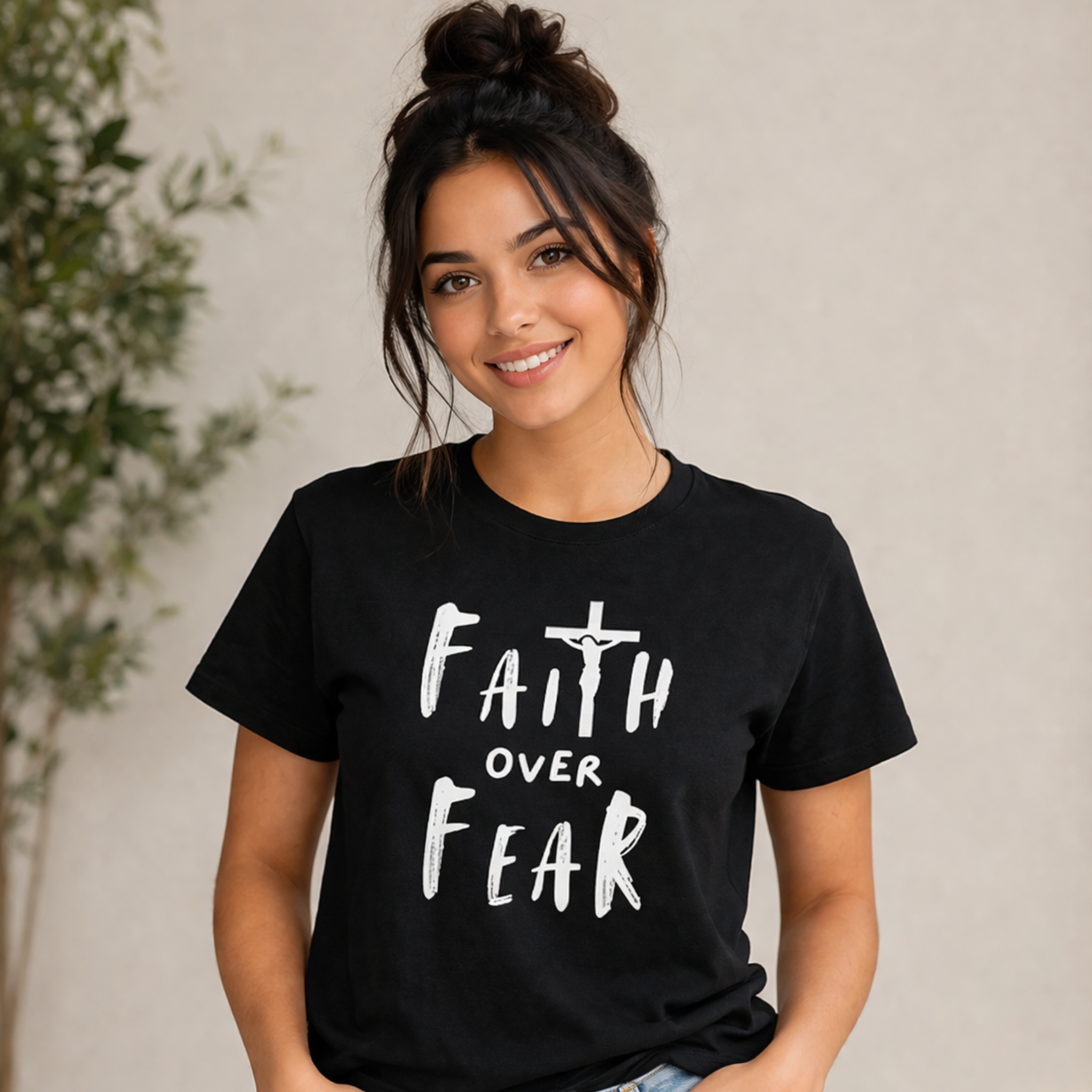 Black short-sleeve T-shirt with white 'Faith over Fear' cross graphic