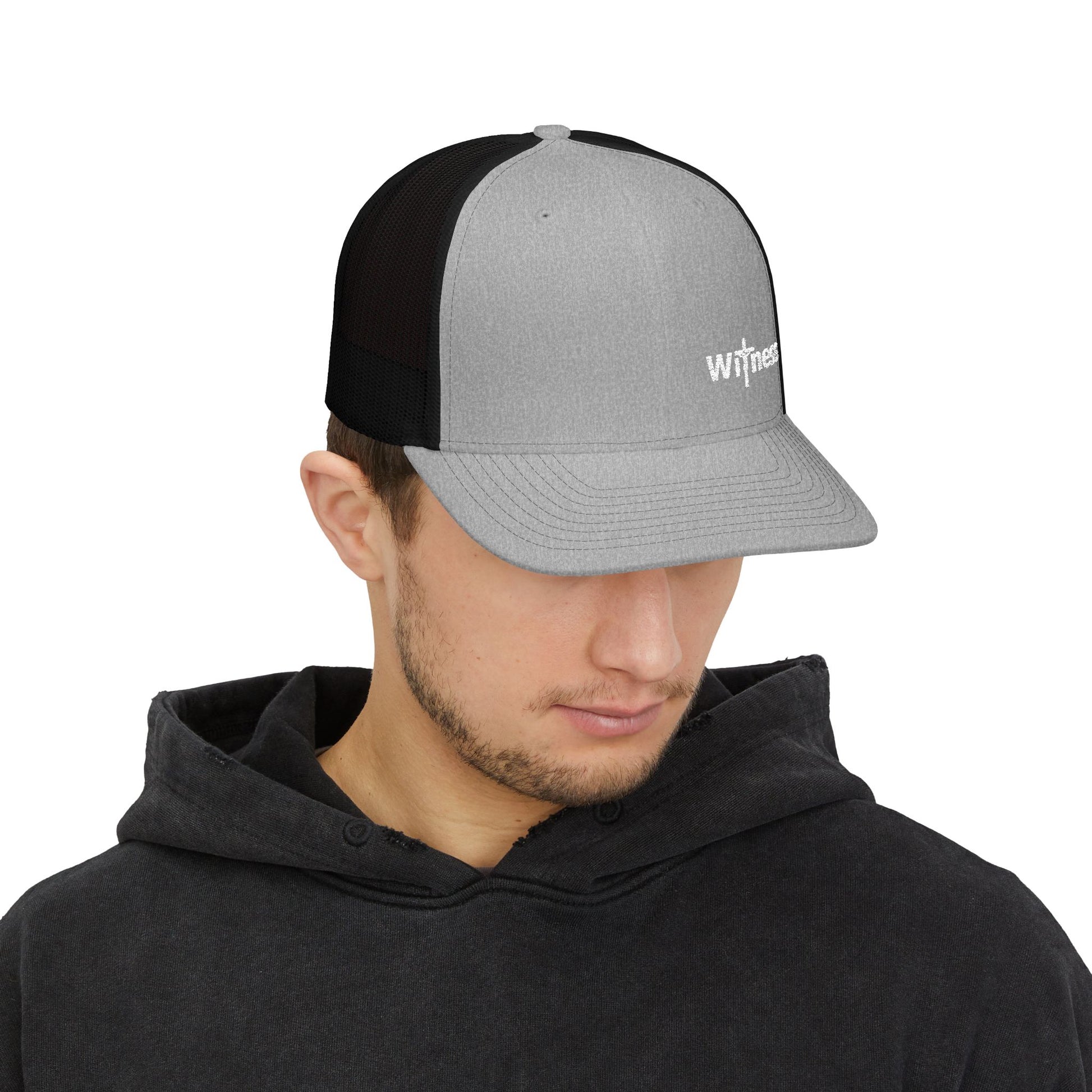 Heather gray trucker cap with black panel, embroidered Witness logo, adjustable strap