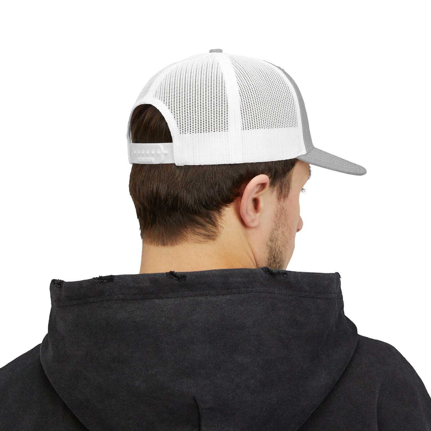 White trucker hat worn from the side, with mesh back and curved brim