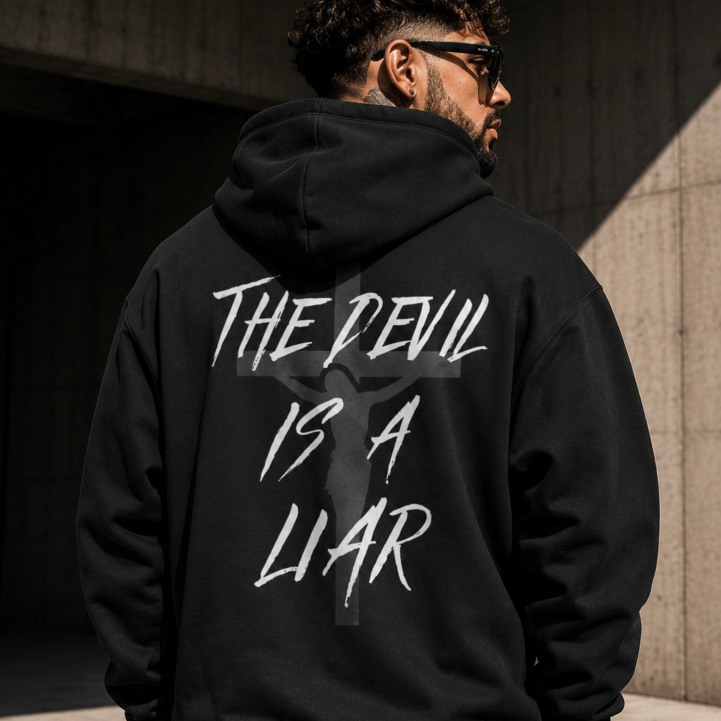 Black hoodie with hood; back graphic “THE DEVIL IS A LIAR”