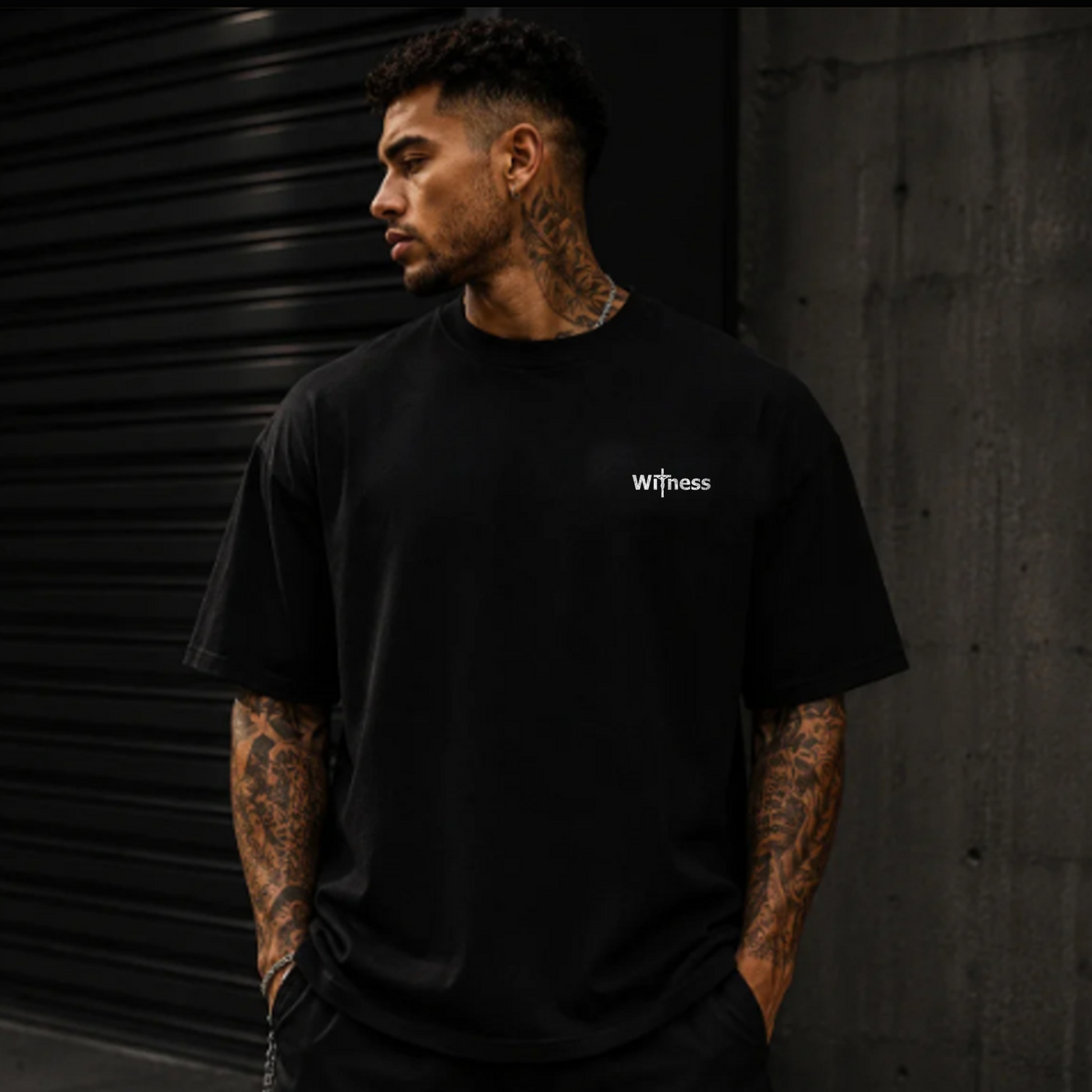 Black T-shirt with small front 'Witness' text graphic